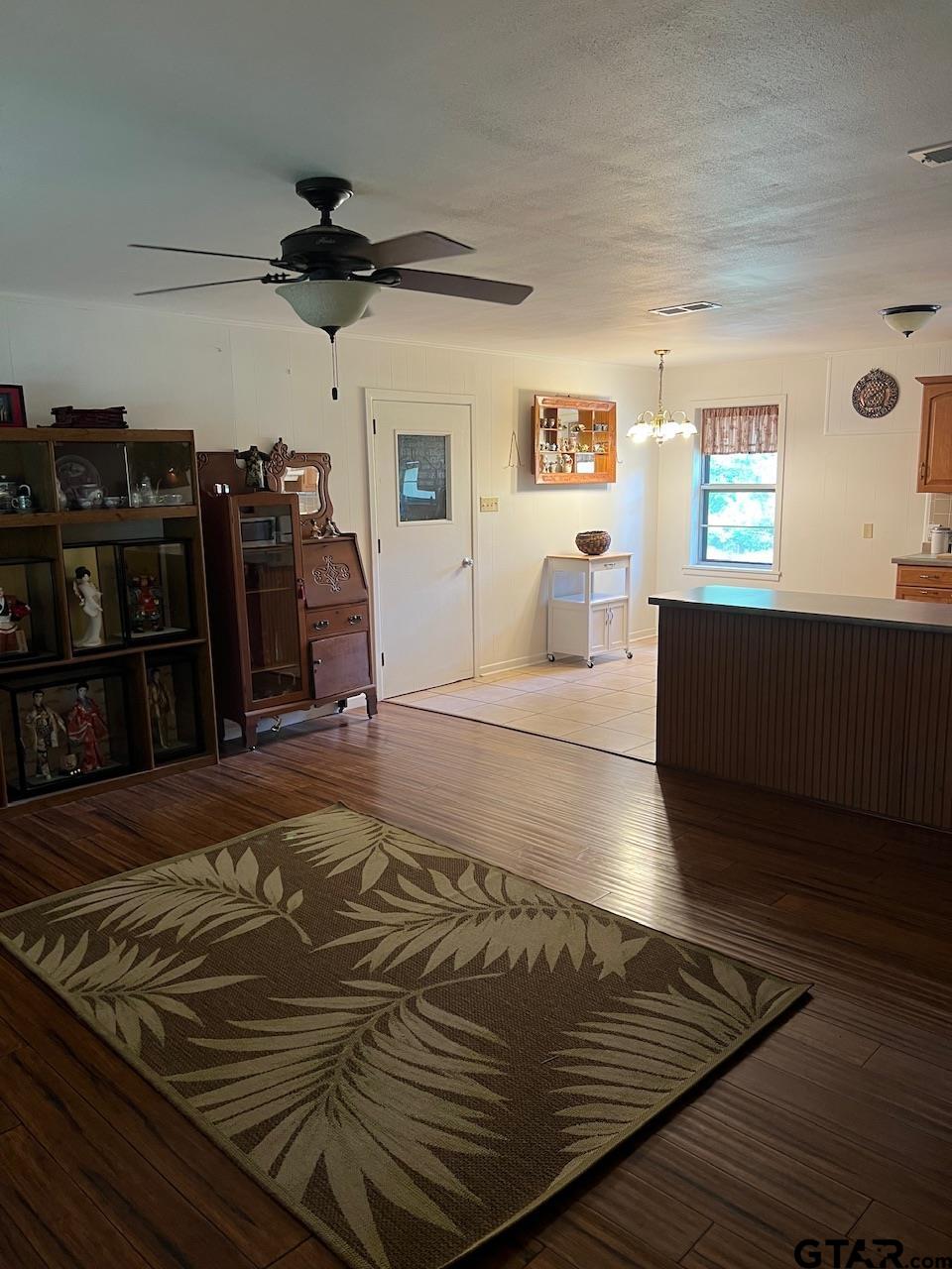 320 Bowers Street Lindale, TX 75771 - Photo 19 of 31 a living room with hard wood floors and a couch