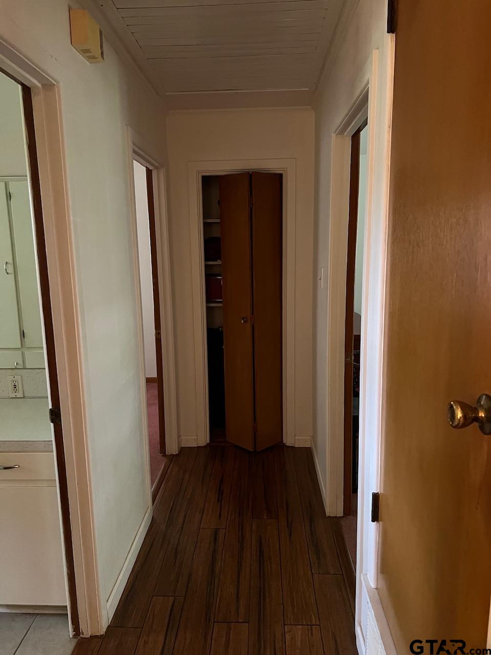 320 Bowers Street Lindale, TX 75771 - Photo 22 of 31 a view of a hallway with wooden floor and staircase