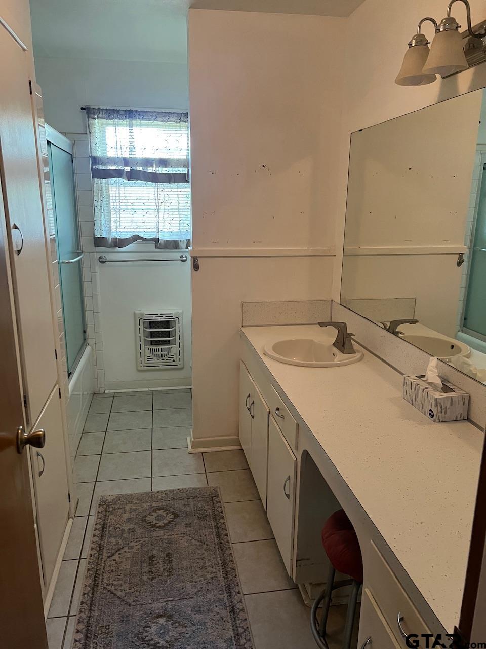320 Bowers Street Lindale, TX 75771 - Photo 23 of 31 a view of a bathroom with a sink and mirror