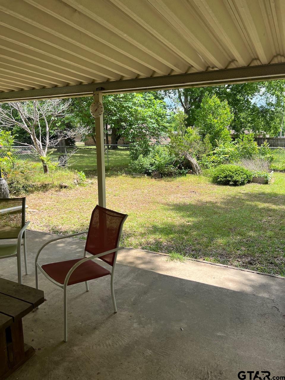 320 Bowers Street Lindale, TX 75771 - Photo 27 of 31 a view of a yard with furniture and outdoor space