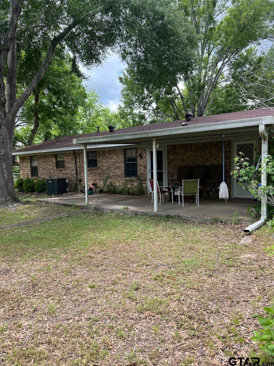 320 Bowers Street Lindale, TX 75771 - Photo 31 of 31 a view of a house with backyard porch and sitting area