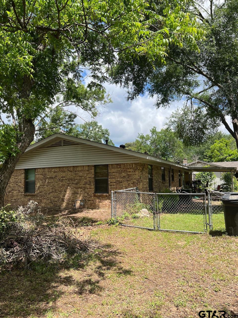 320 Bowers Street Lindale, TX 75771 - Photo 4 of 31 a view of a house with a yard