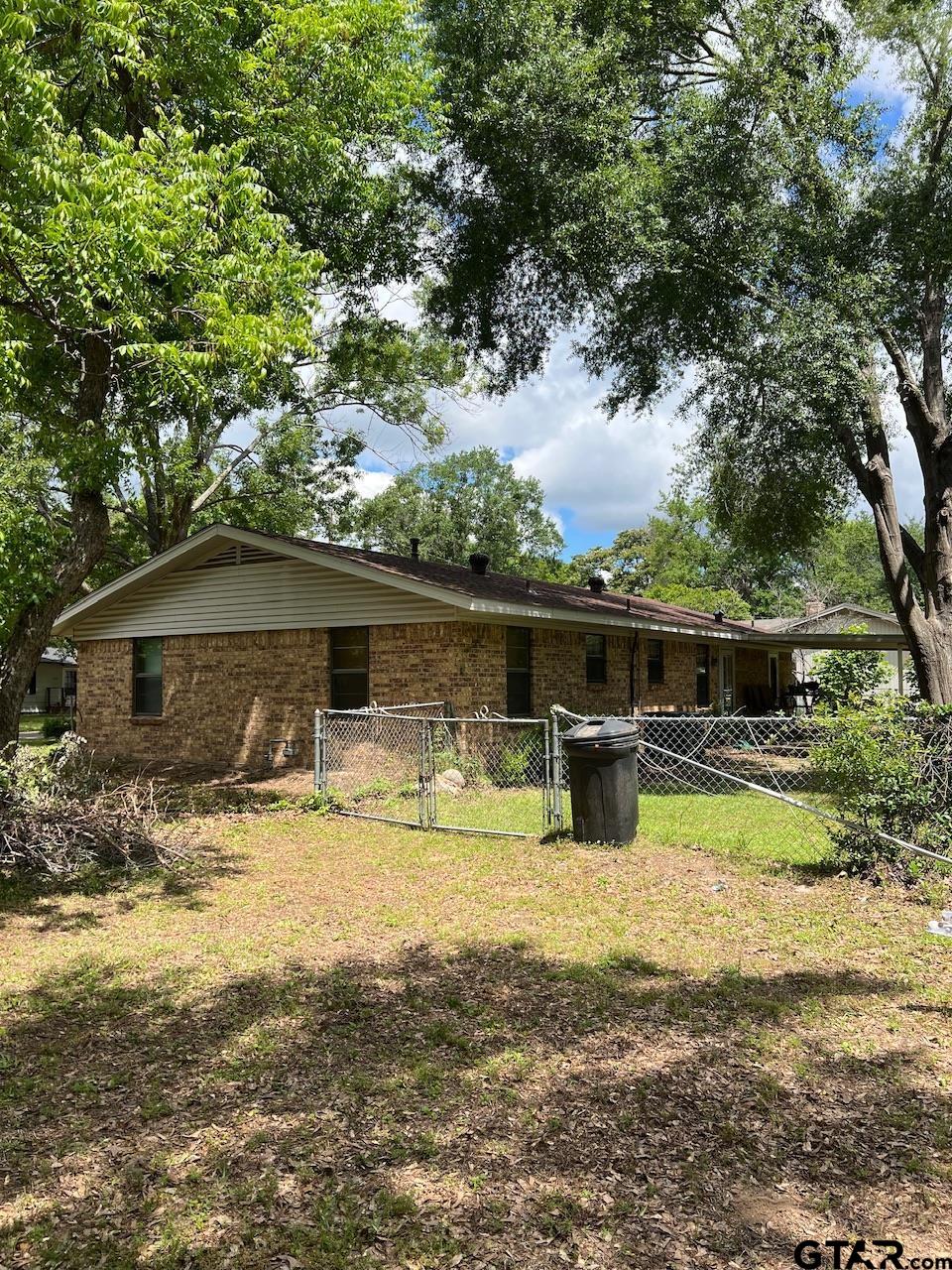 320 Bowers Street Lindale, TX 75771 - Photo 6 of 31 a view of a house with yard and sitting area
