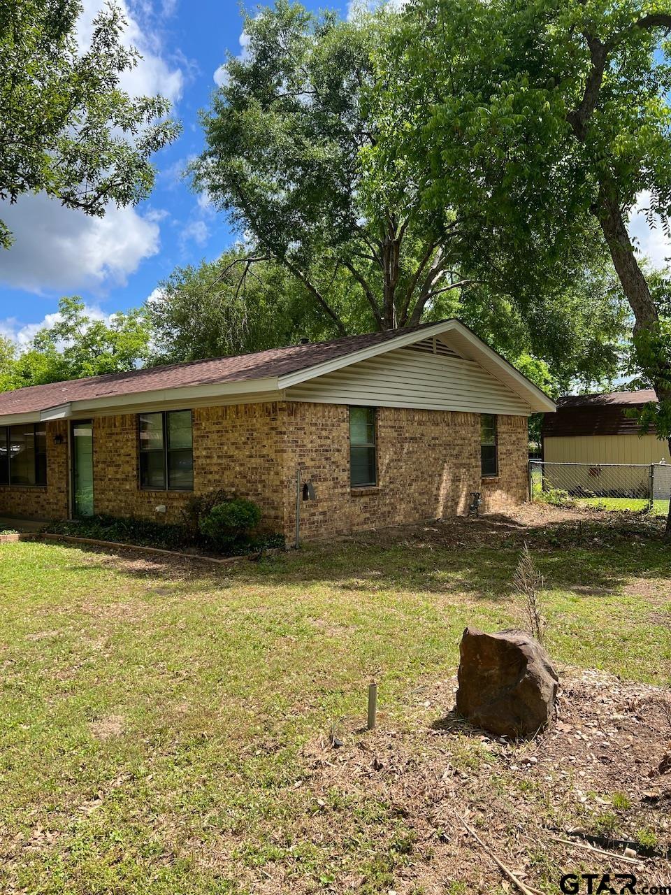 320 Bowers Street Lindale, TX 75771 - Photo 7 of 31 a front view of a house with a yard