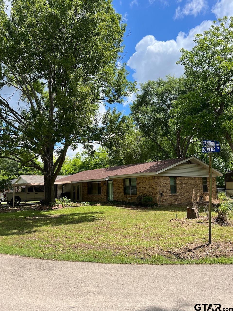 320 Bowers Street Lindale, TX 75771 - Photo 9 of 31 a front view of a house with a yard