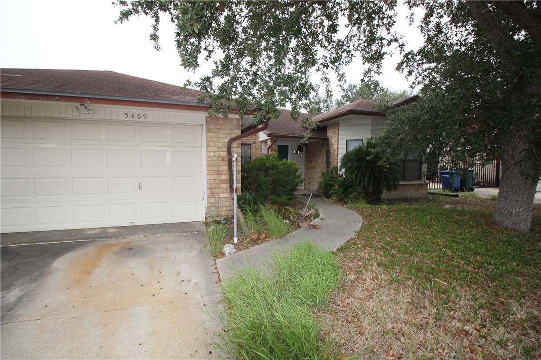 5409 Timbergate Drive Corpus Christi, TX 78413 - Photo 3 of 14 a view of a house with a yard
