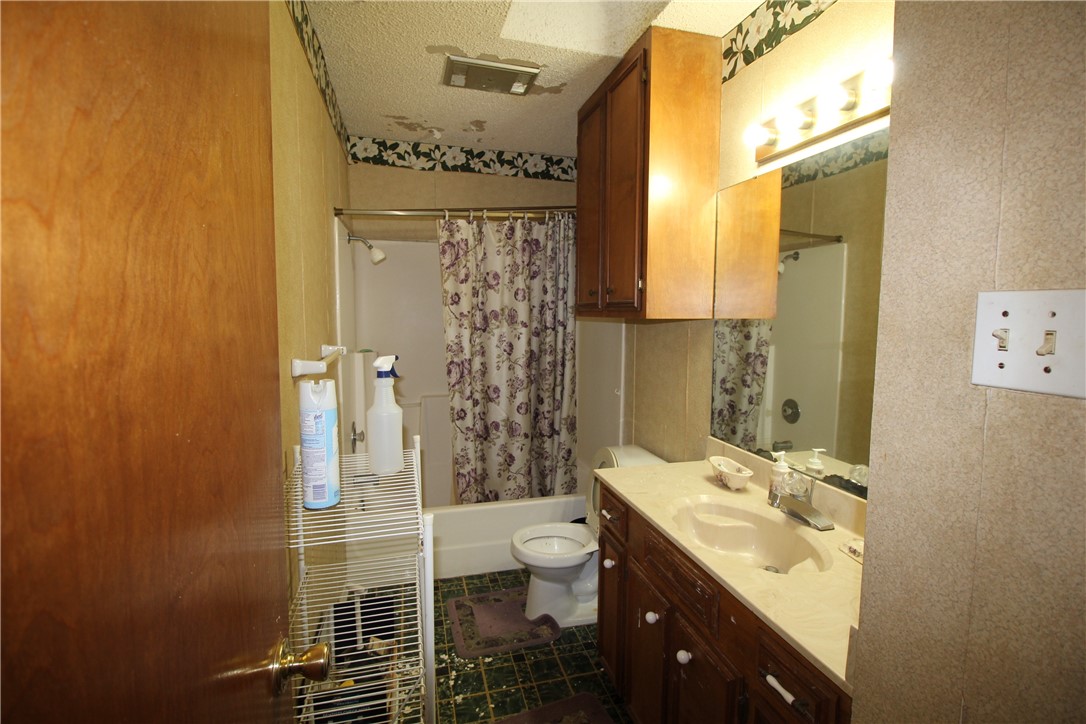 5409 Timbergate Drive Corpus Christi, TX 78413 - Photo 10 of 14 a bathroom with a double vanity sink toilet and shower