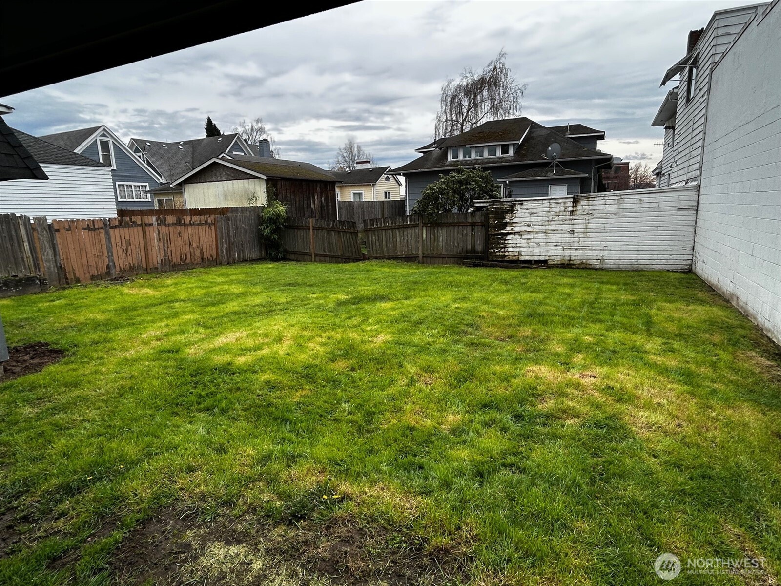302 Crawford Street Kelso, WA 98626 - Photo 16 of 16 a view of a house with a back yard