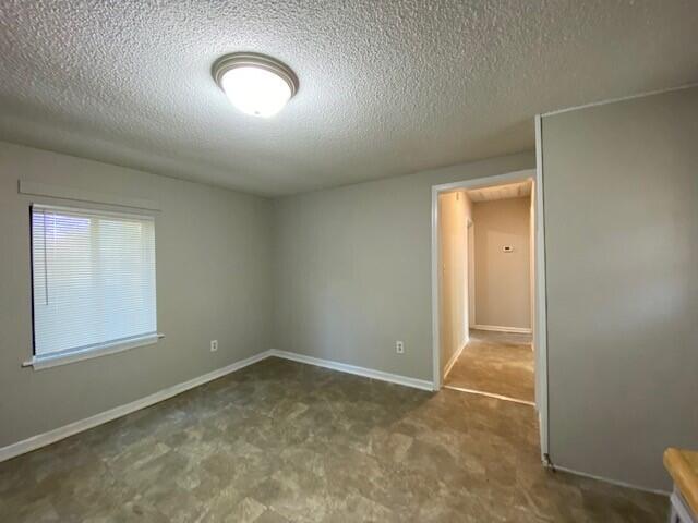 80 Dillons Fork Road Fieldale, VA 24089 - Photo 8 of 11 an empty room with a vanity and a window