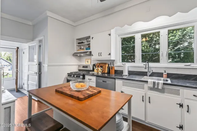 a kitchen with a stove and a sink