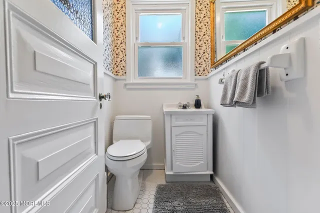 a bathroom with a toilet and a sink