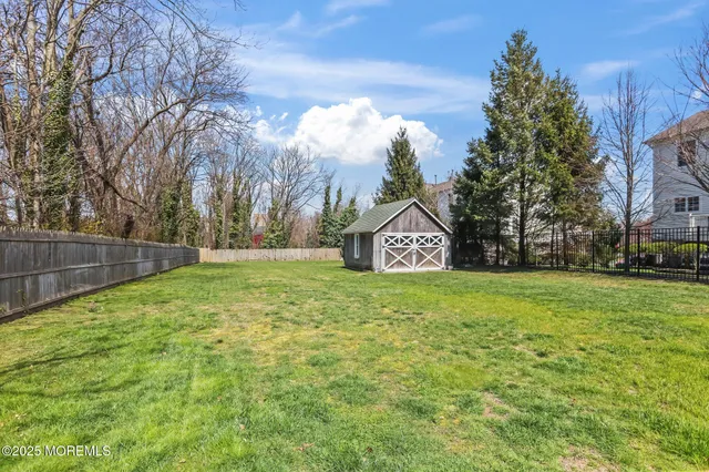 a view of a house with a big yard