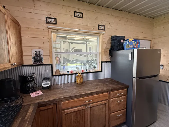 a kitchen with granite countertop a stove and cabinets