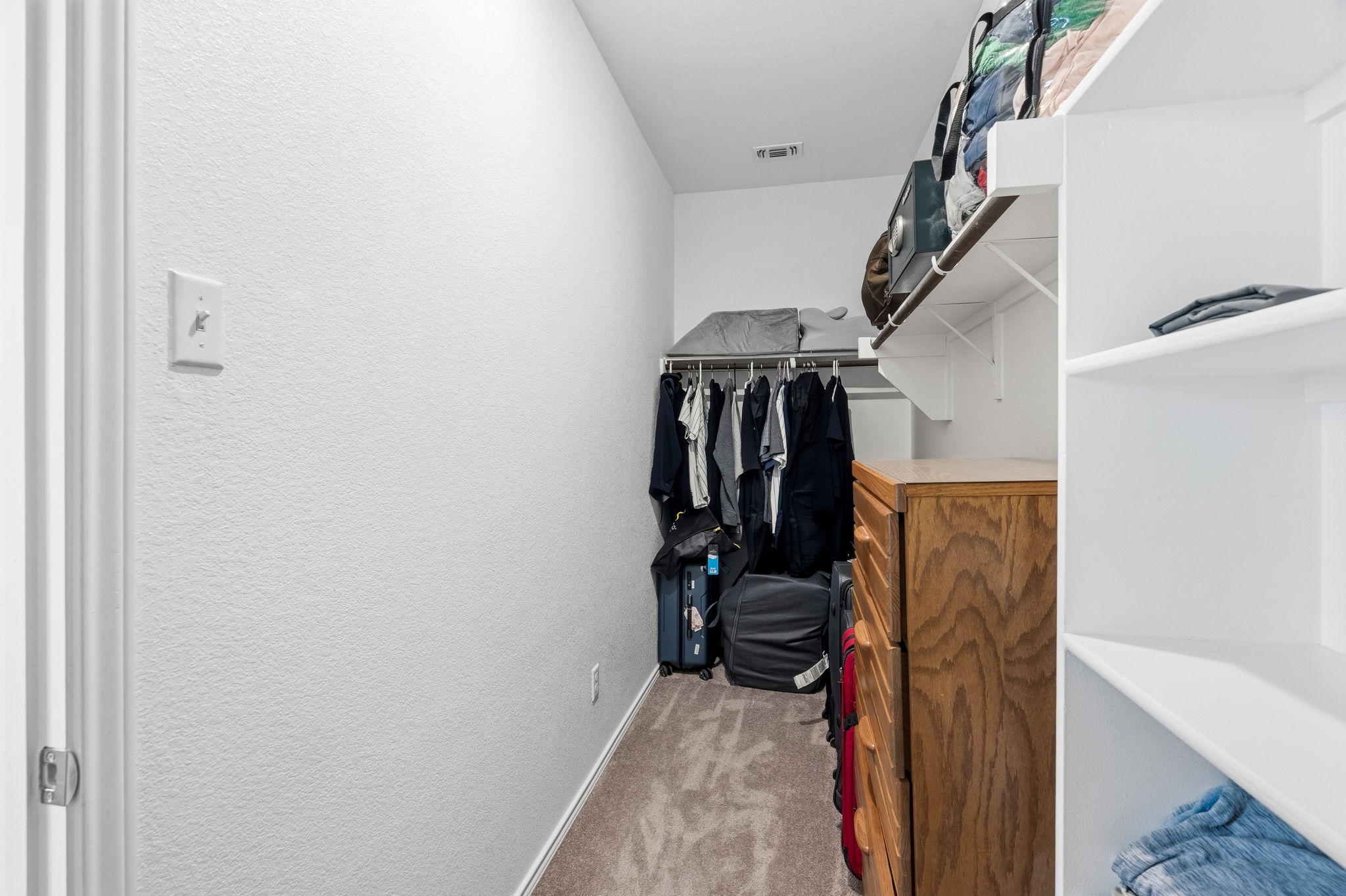 1600 Hope Rnch Road Leander, TX 78641 - Photo 17 of 23 a view of walk in closet with clothes and shoes