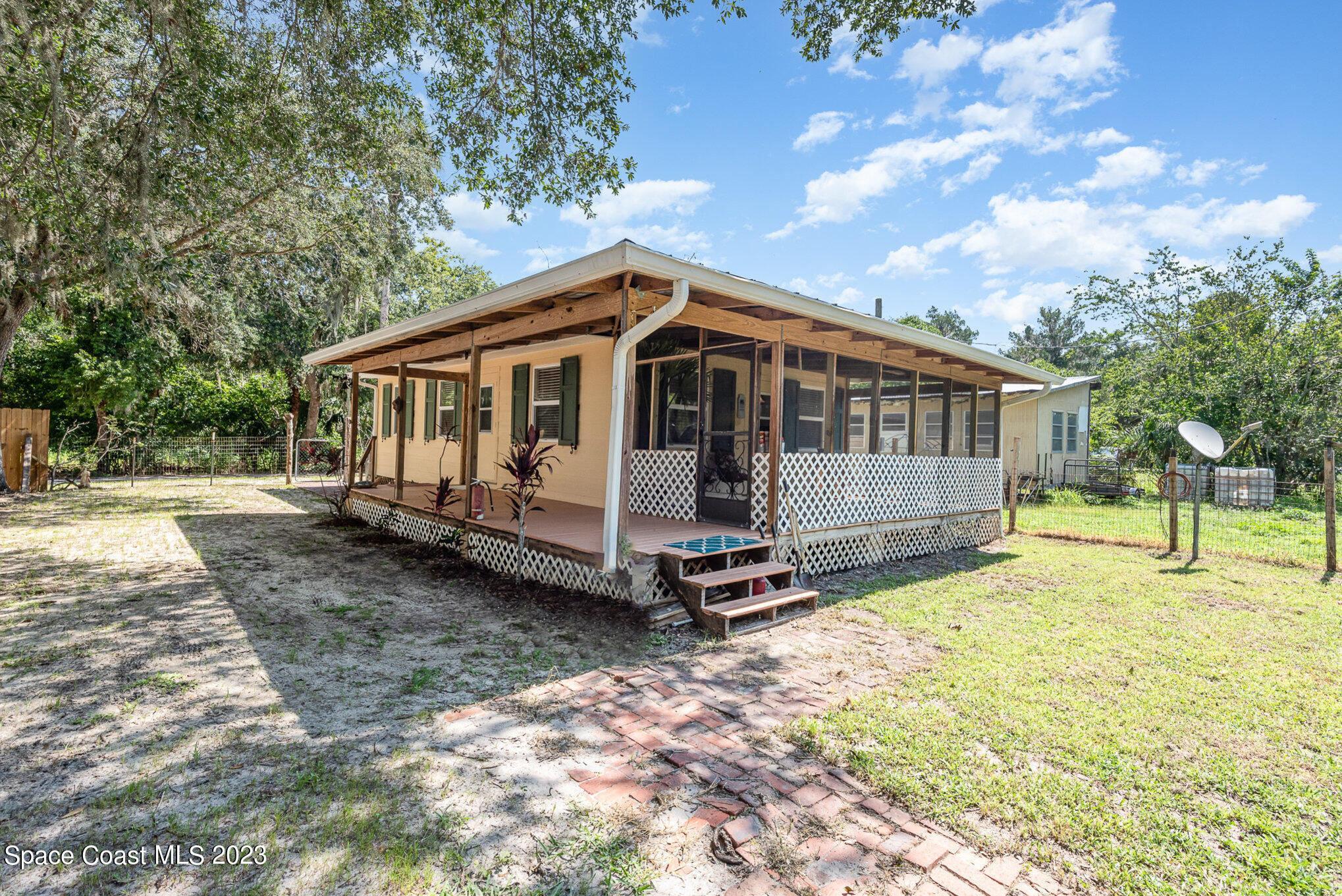 8219 Baxter Point Road Mims, FL 32754 - Photo 1 of 24 a view of a house with a yard