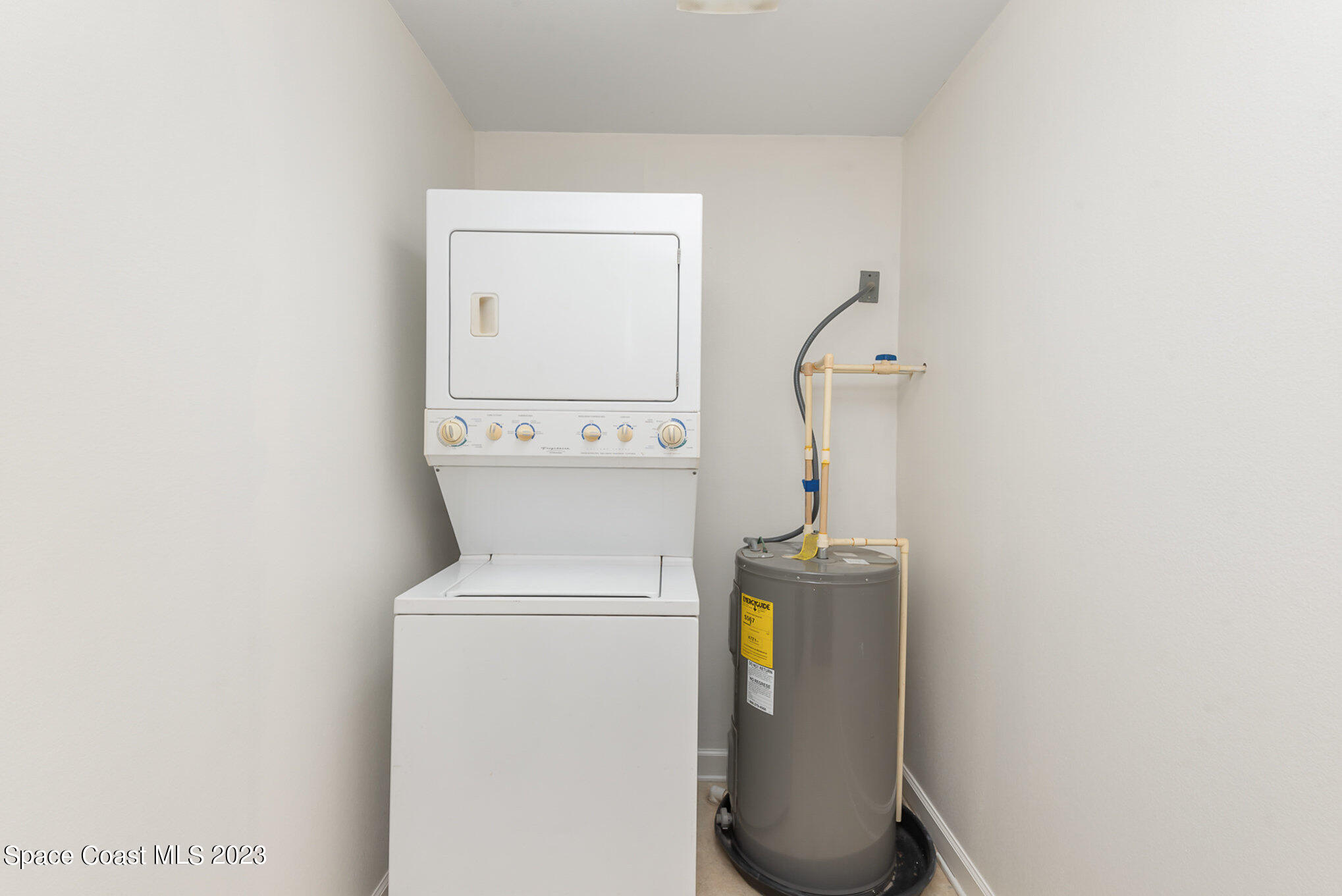 8219 Baxter Point Road Mims, FL 32754 - Photo 17 of 24 a utility room with dryer and washer