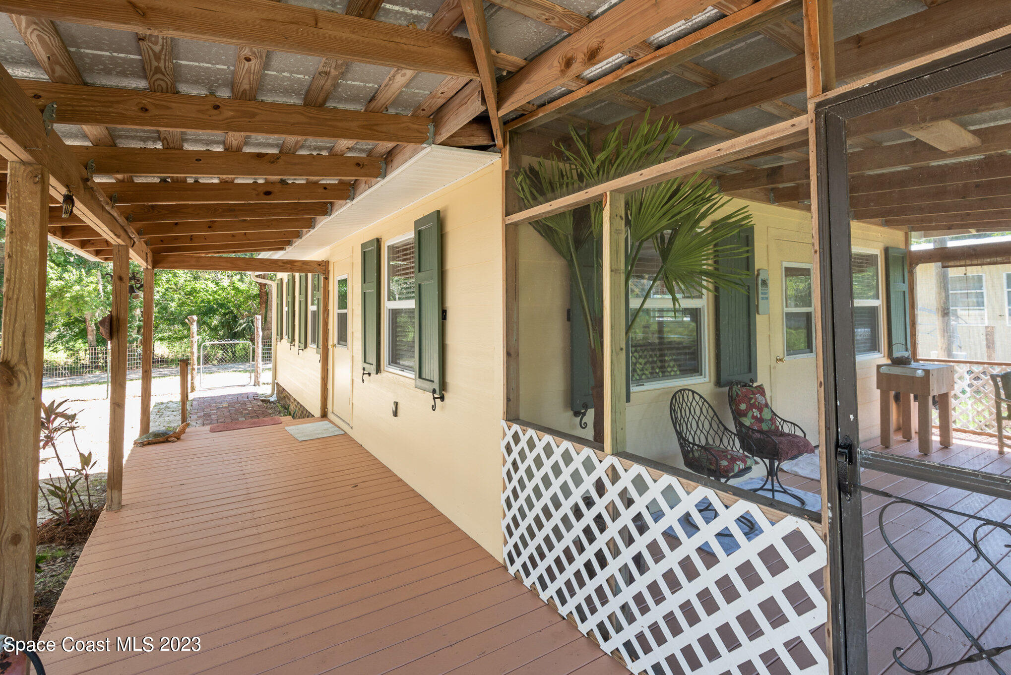 8219 Baxter Point Road Mims, FL 32754 - Photo 2 of 24 a living room with furniture