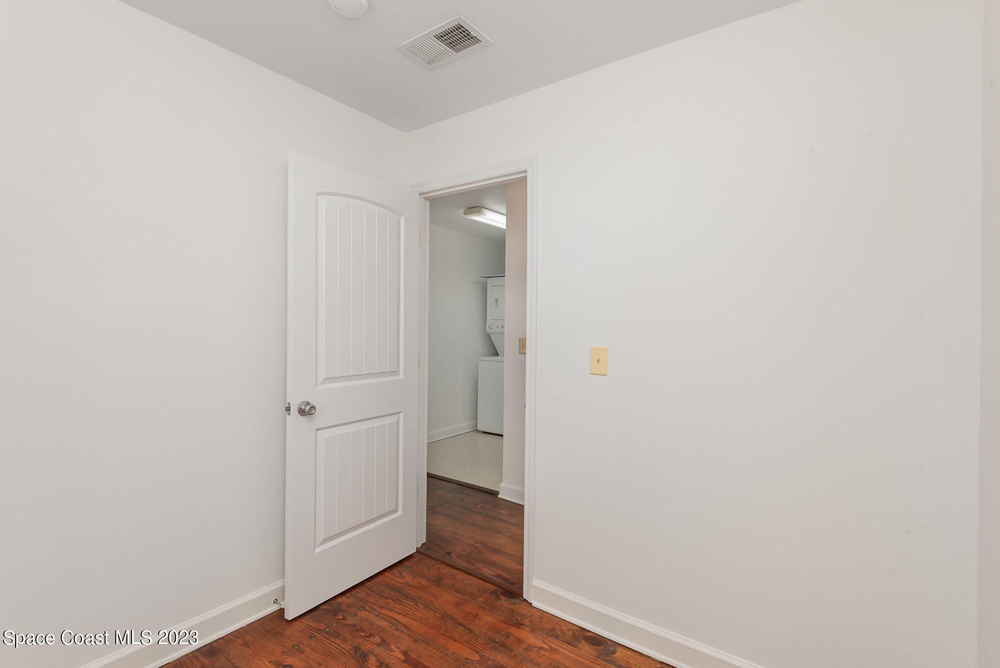 8219 Baxter Point Road Mims, FL 32754 - Photo 23 of 24 a view of a hallway with wooden floor