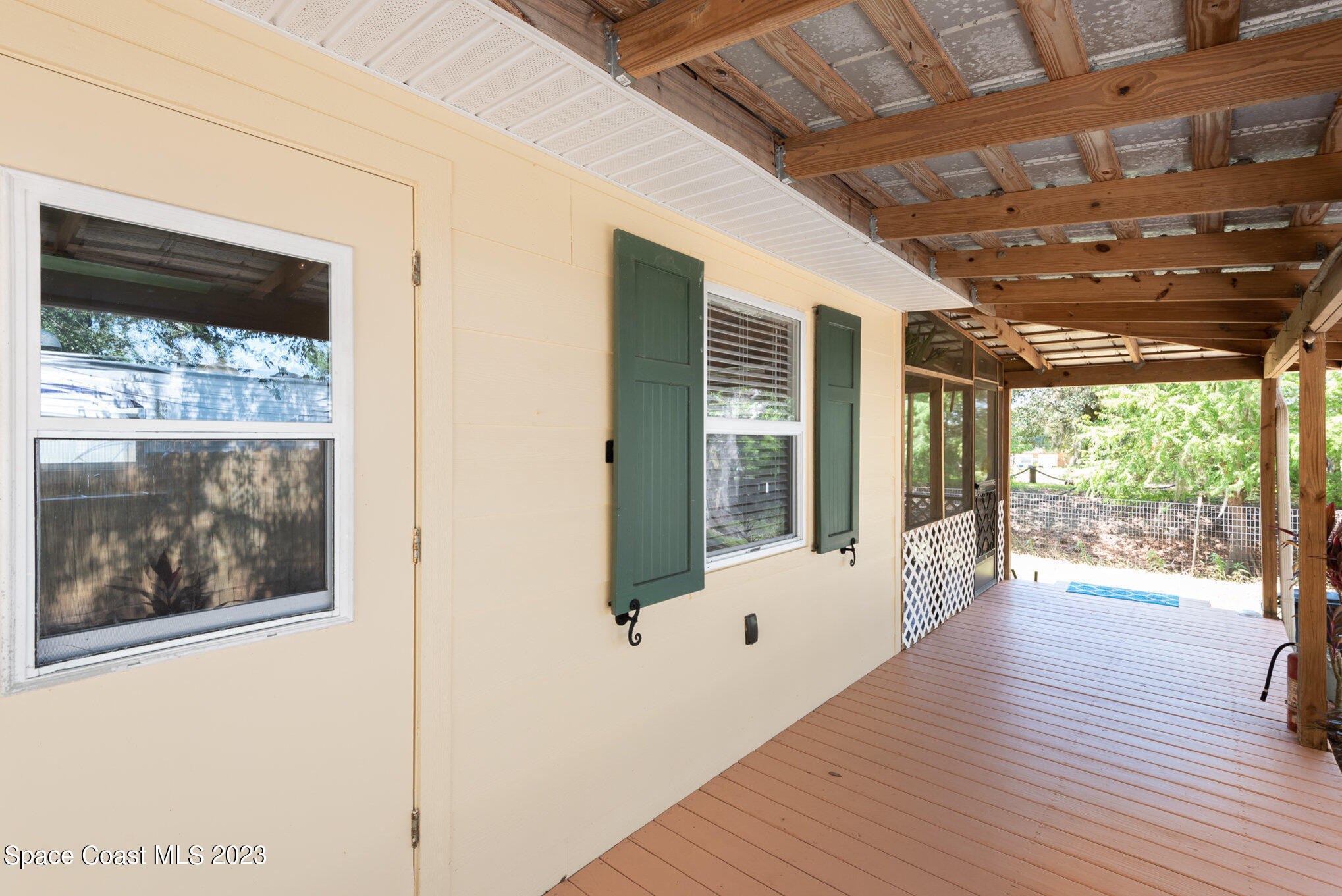8219 Baxter Point Road Mims, FL 32754 - Photo 3 of 24 a view of outdoor space with wooden floor and windows