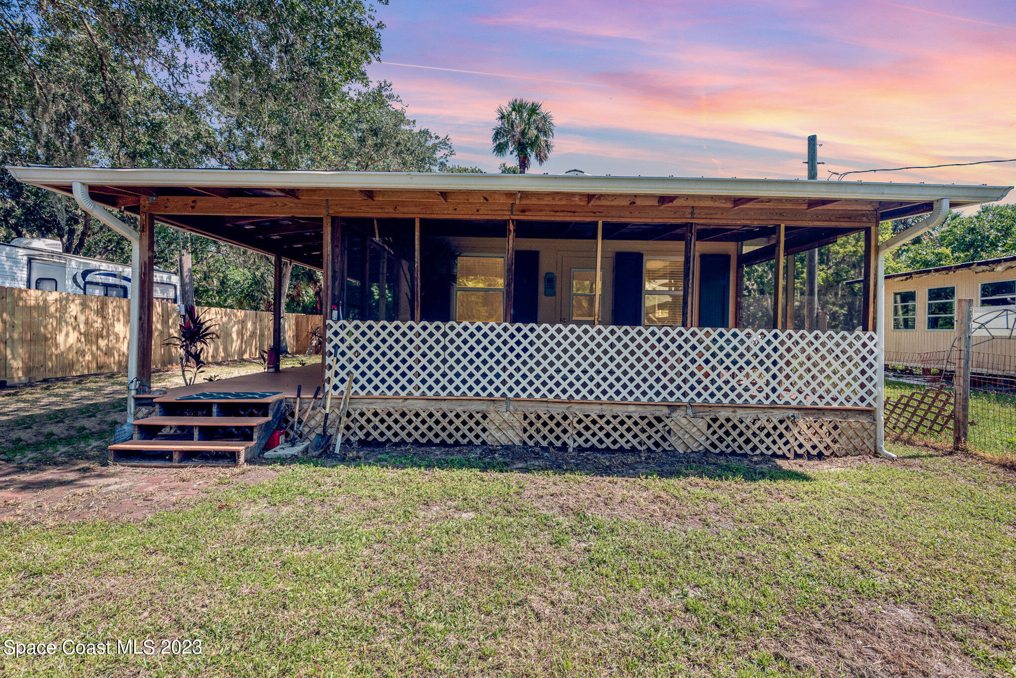8219 Baxter Point Road Mims, FL 32754 - Photo 7 of 24 a view of a backyard