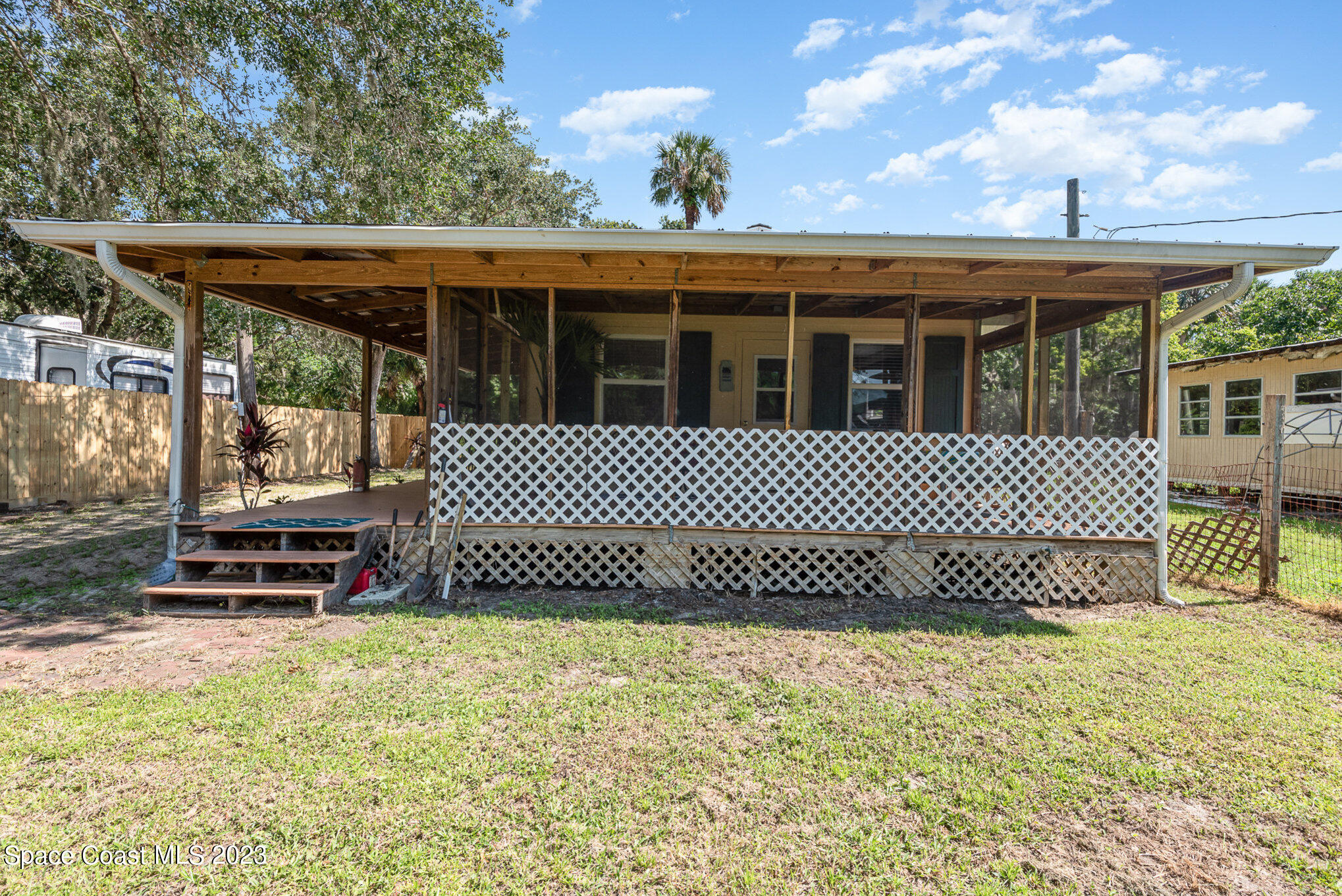 8219 Baxter Point Road Mims, FL 32754 - Photo 8 of 24 a view of a backyard