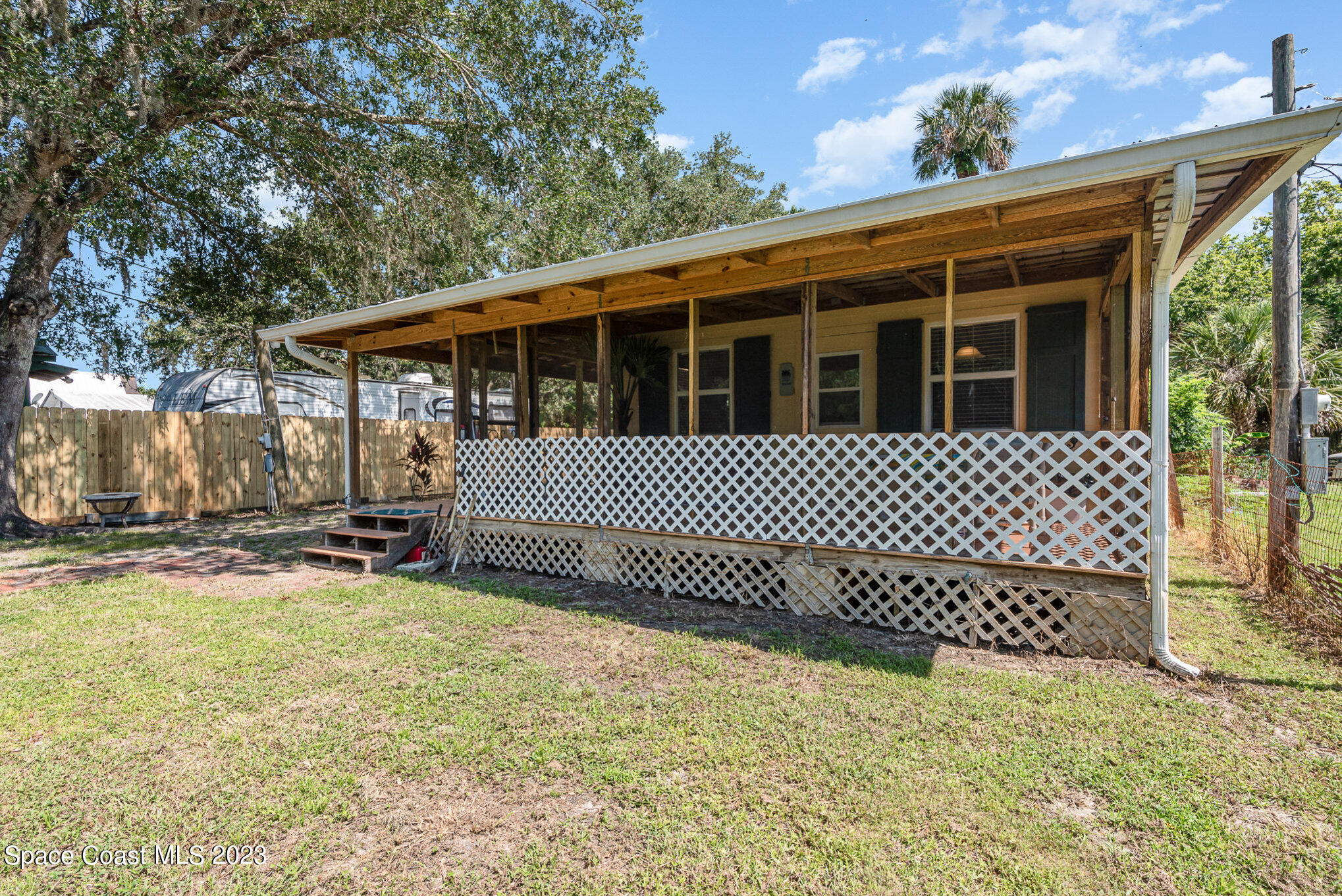 8219 Baxter Point Road Mims, FL 32754 - Photo 9 of 24 a view of a house with a bed