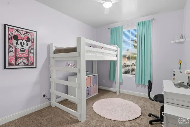 a bathroom with a sink toilet and a mirror