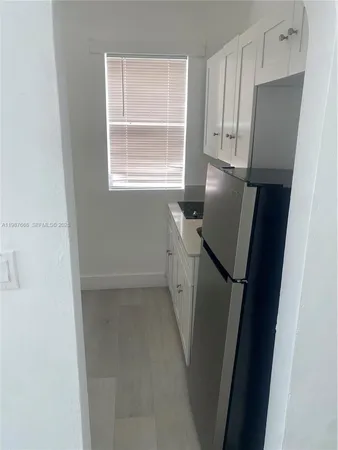 a utility room with closet dryer and washer