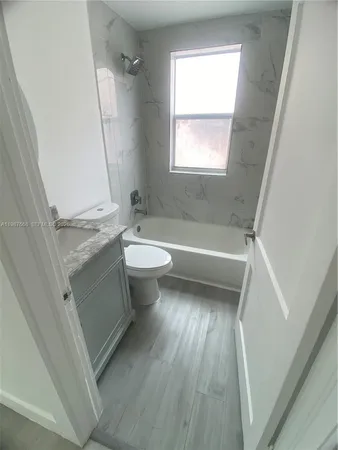 a bathroom with a sink and a bathtub