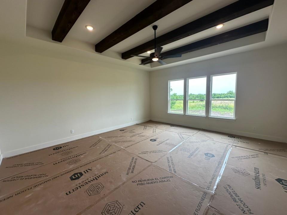 205 Cobb Road Leonard, TX 75452 - Photo 17 of 28 Spacious room featuring a tray ceiling with exposed wood beams, recessed lighting, and a ceiling fan
