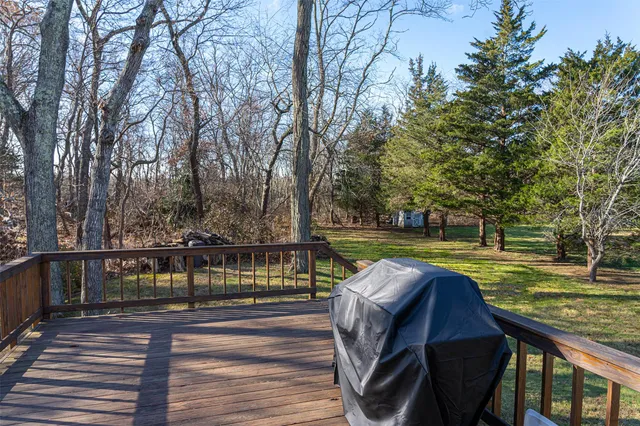 a view of a swimming pool with a deck