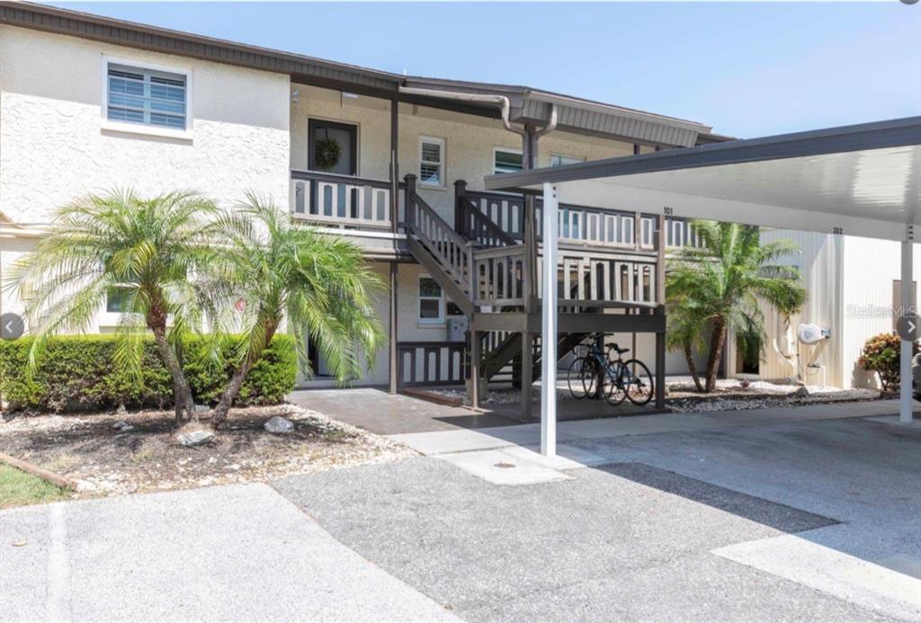4609 Marine Parkway, Unit 102 New Port Richey, FL 34652 - Photo 1 of 2 front view of a building with a street
