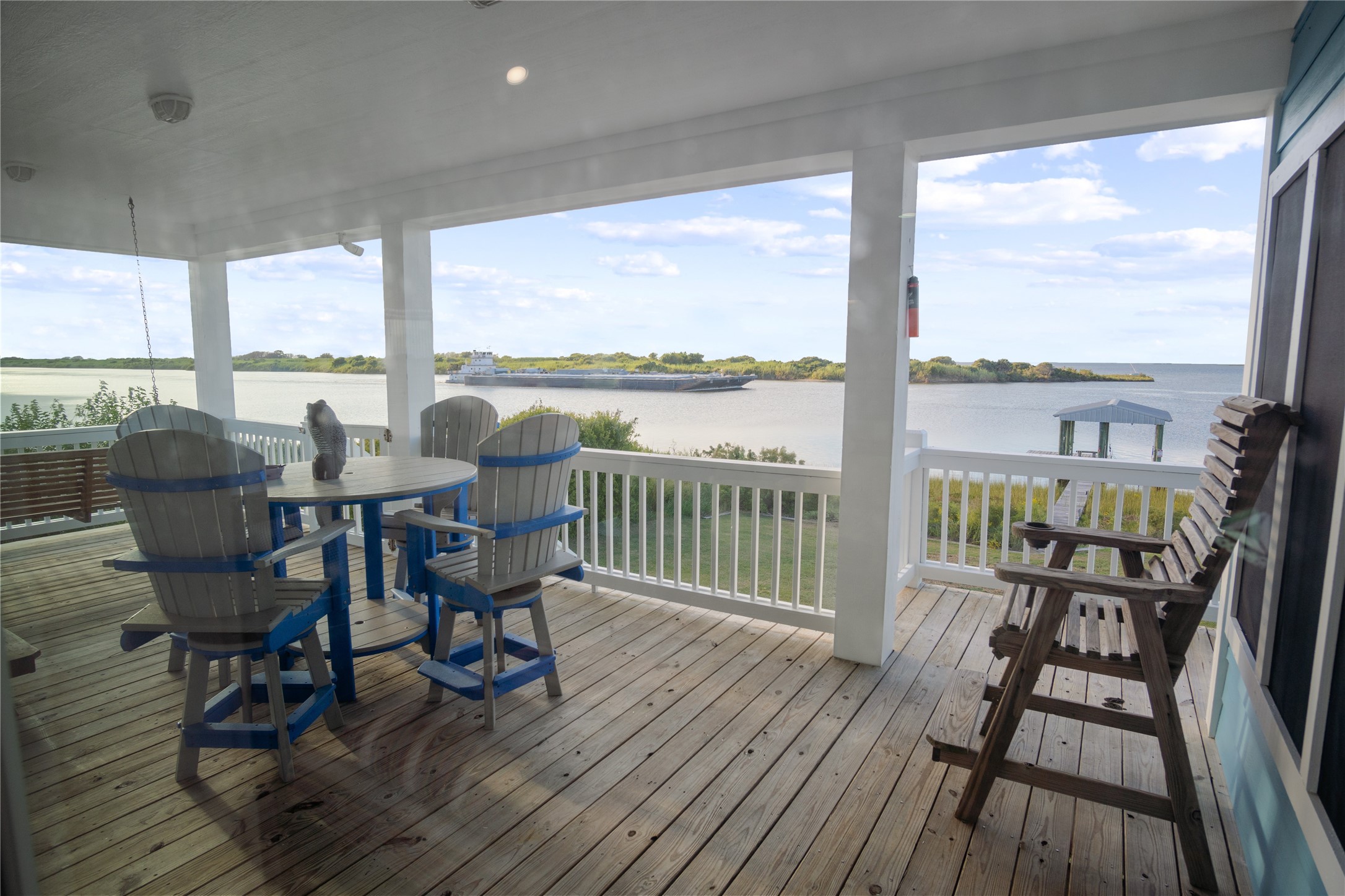 1682 Hamilton Avenue Port Bolivar, TX 77650 - Photo 29 of 38 a view of a balcony with furniture and wooden floor