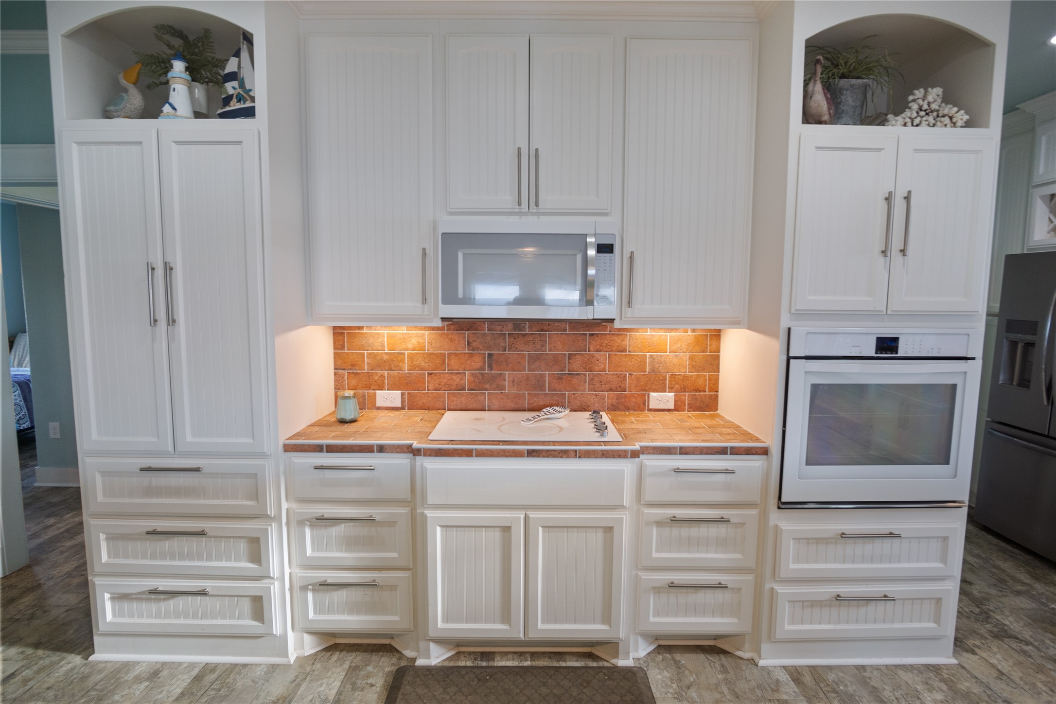 1682 Hamilton Avenue Port Bolivar, TX 77650 - Photo 9 of 38 a kitchen with white cabinets and sink
