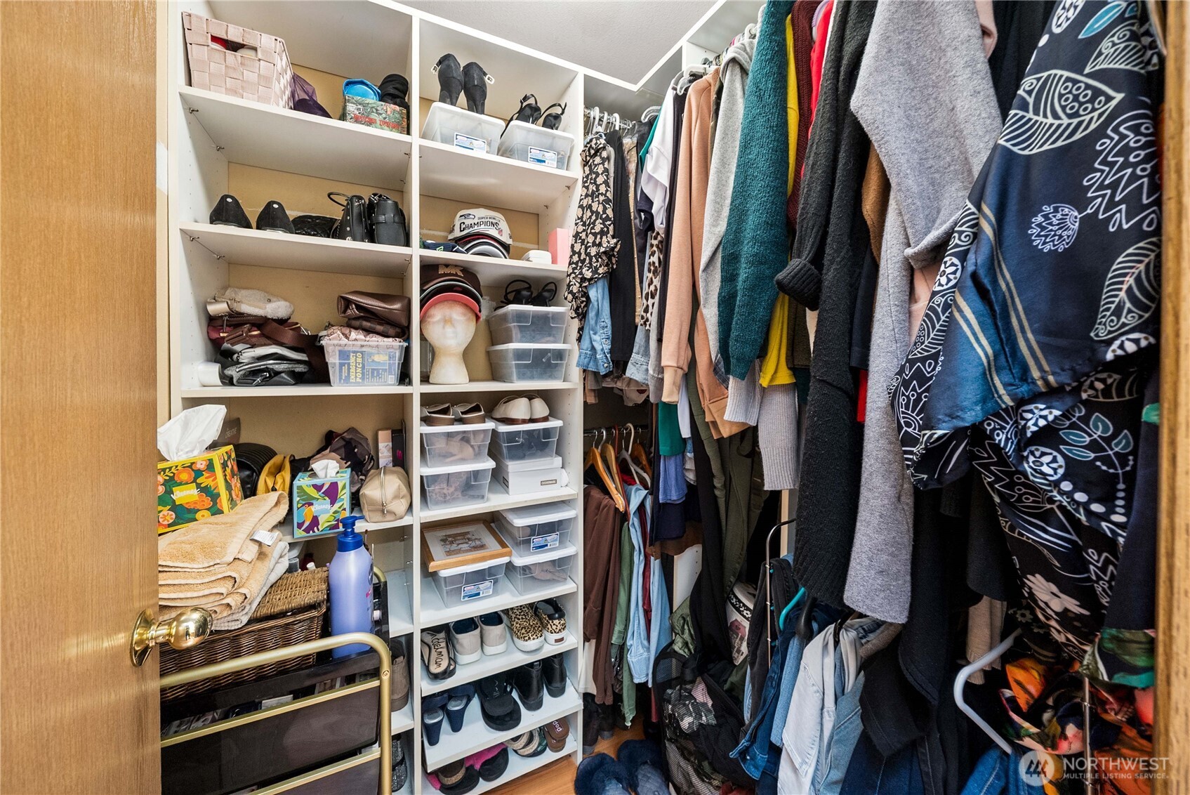 5103 South Garden Loop Road, Unit 25 Seattle, WA 98118 - Photo 13 of 23 a view of walk in closet with clothes and shoes