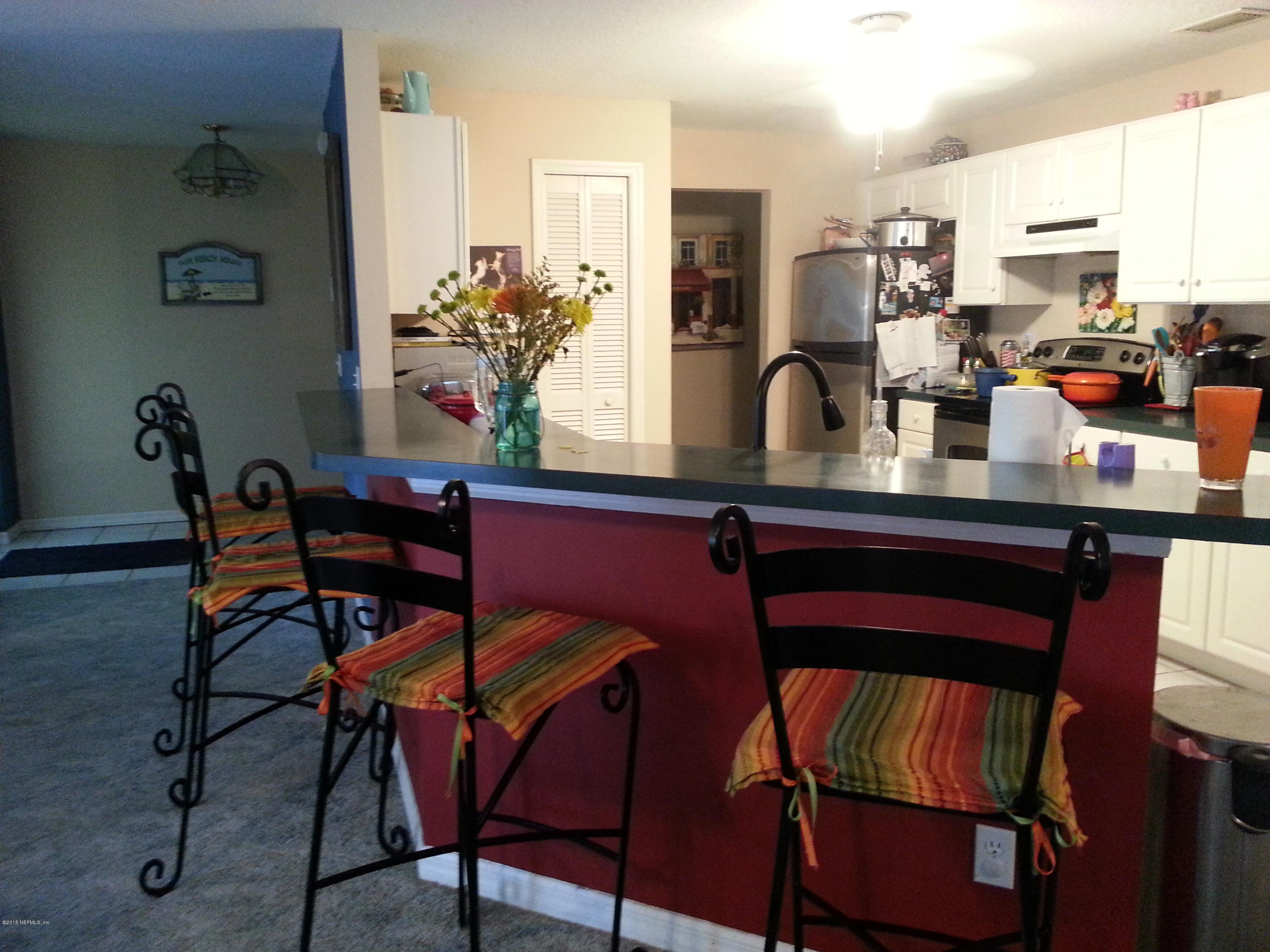 308 Outrigger Way Vilano Beach, FL 32084 - Photo 11 of 33 a dining room with furniture and chandelier