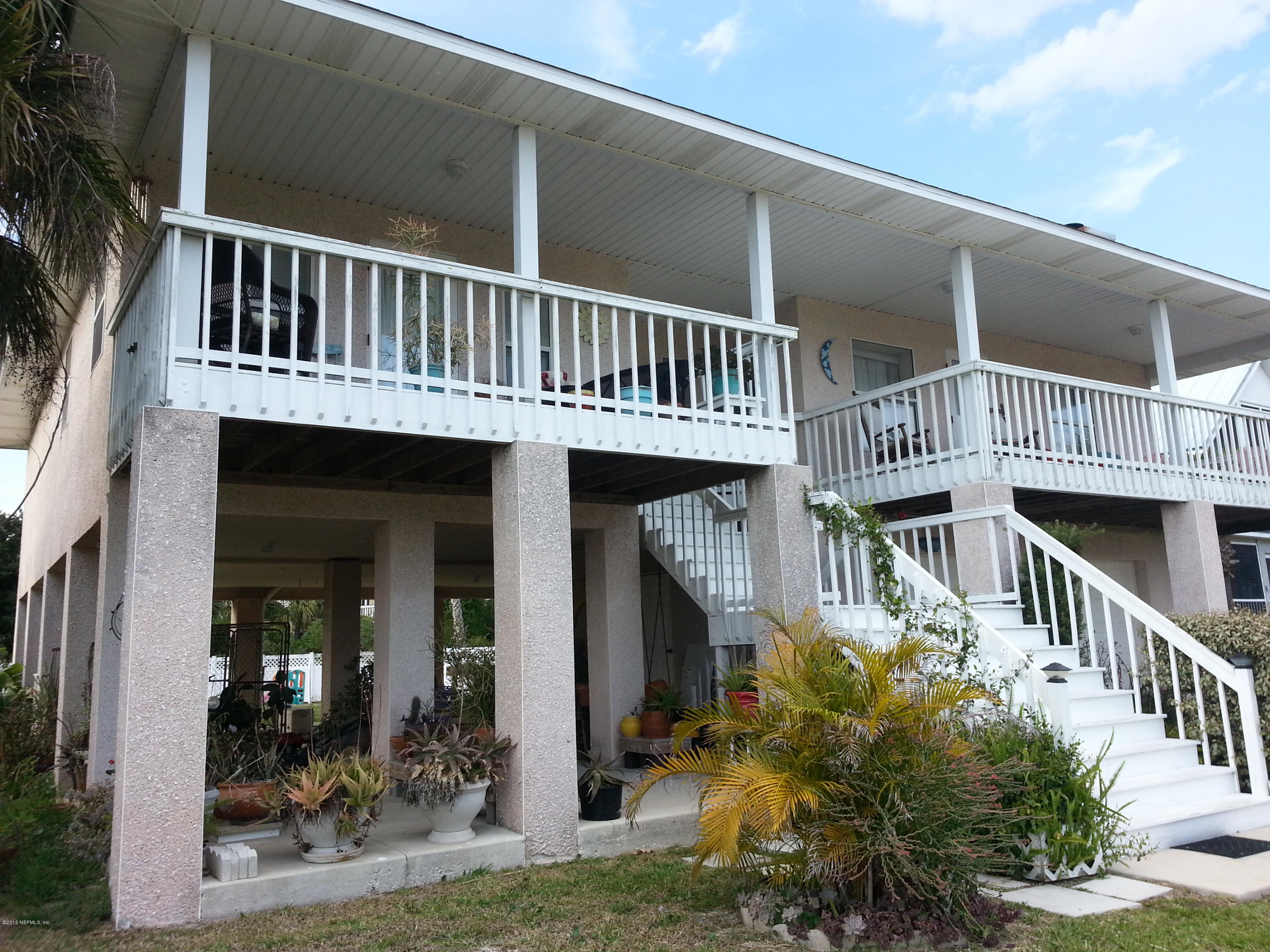 308 Outrigger Way Vilano Beach, FL 32084 - Photo 15 of 33 a view of a house with a small yard