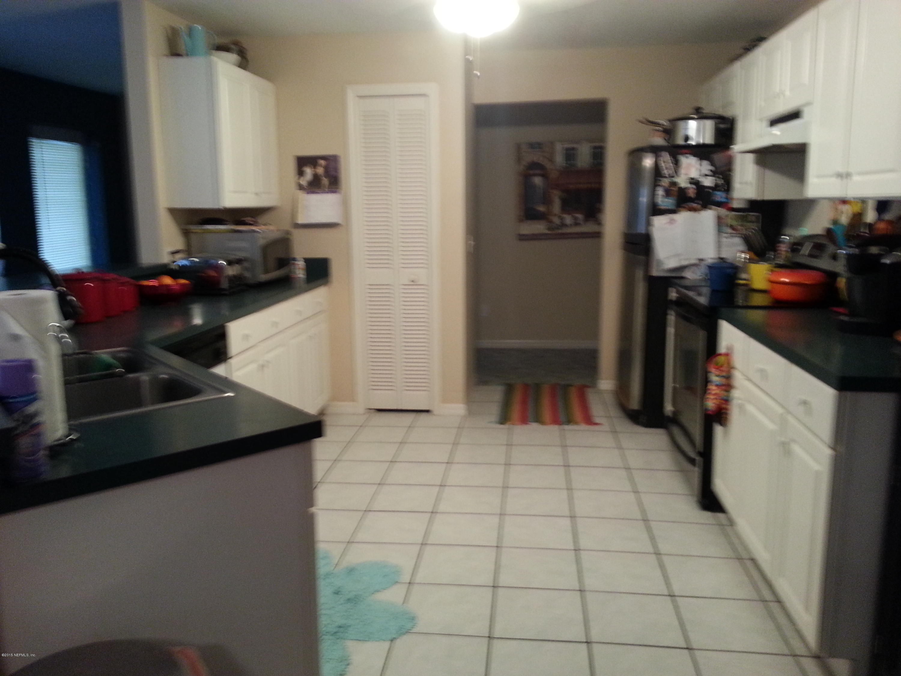 308 Outrigger Way Vilano Beach, FL 32084 - Photo 20 of 33 a kitchen with a sink a stove and refrigerator