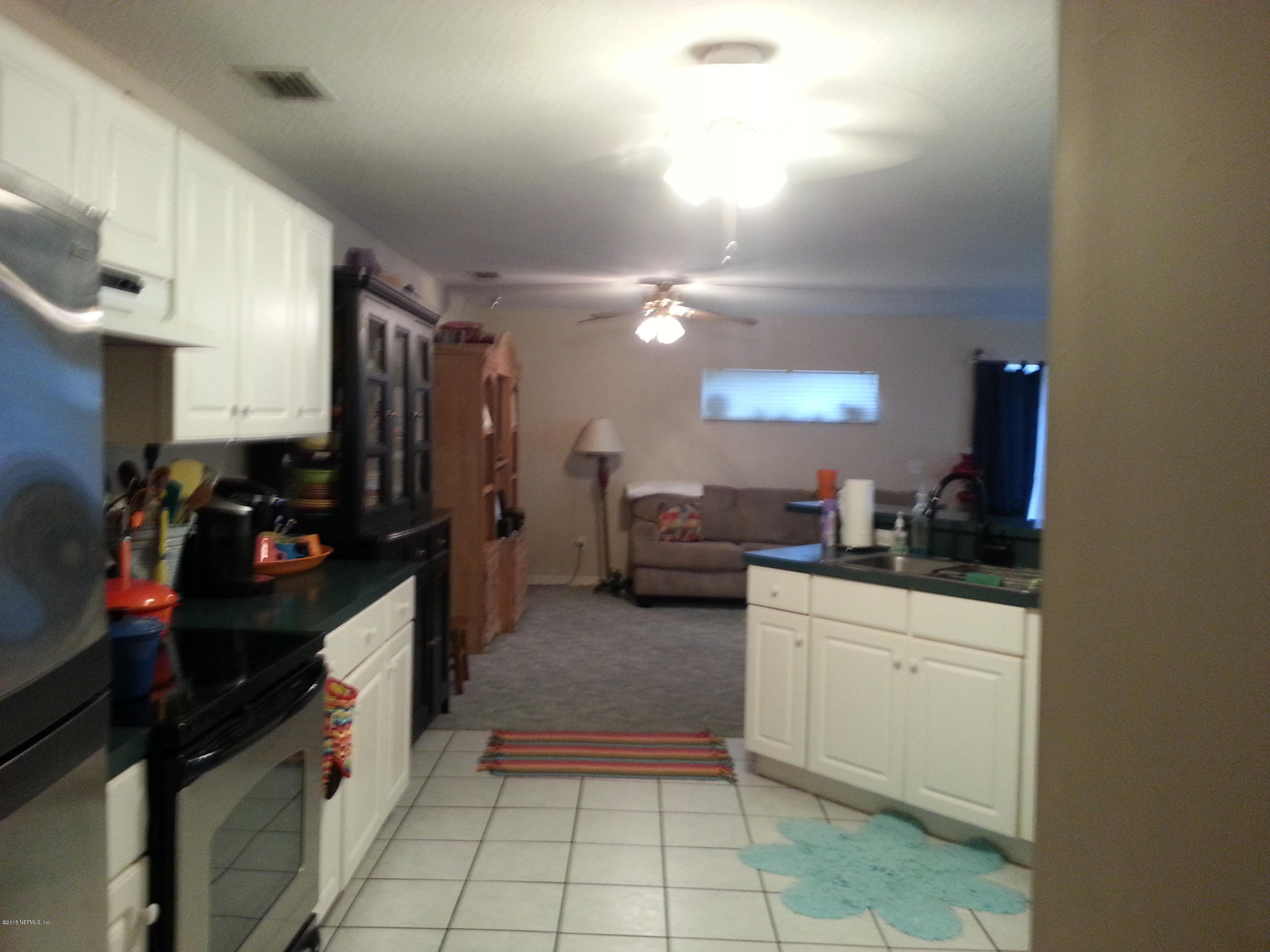 308 Outrigger Way Vilano Beach, FL 32084 - Photo 21 of 33 a kitchen with a sink cabinets and appliances