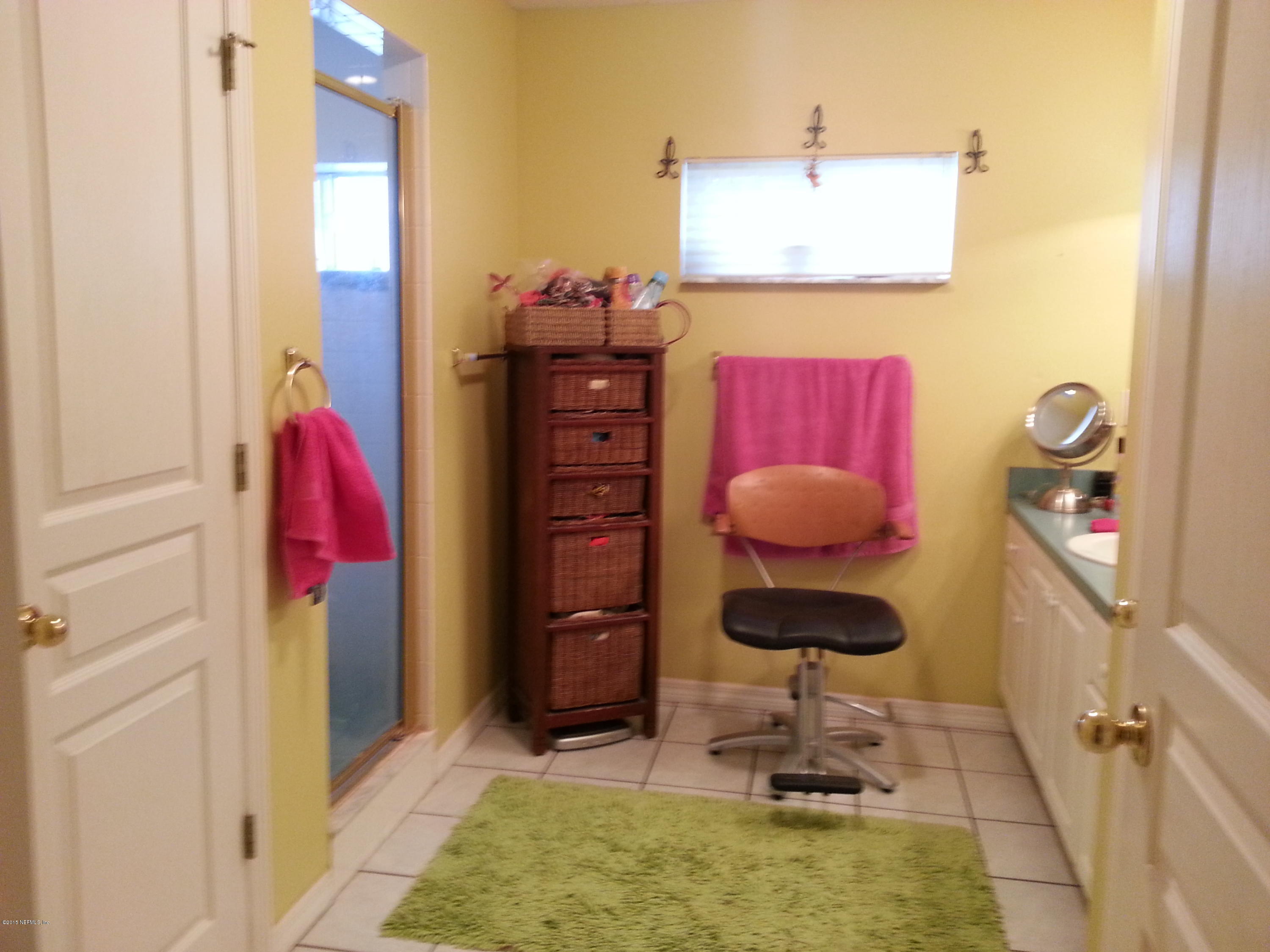 308 Outrigger Way Vilano Beach, FL 32084 - Photo 23 of 33 a room with a rug and gym equipment