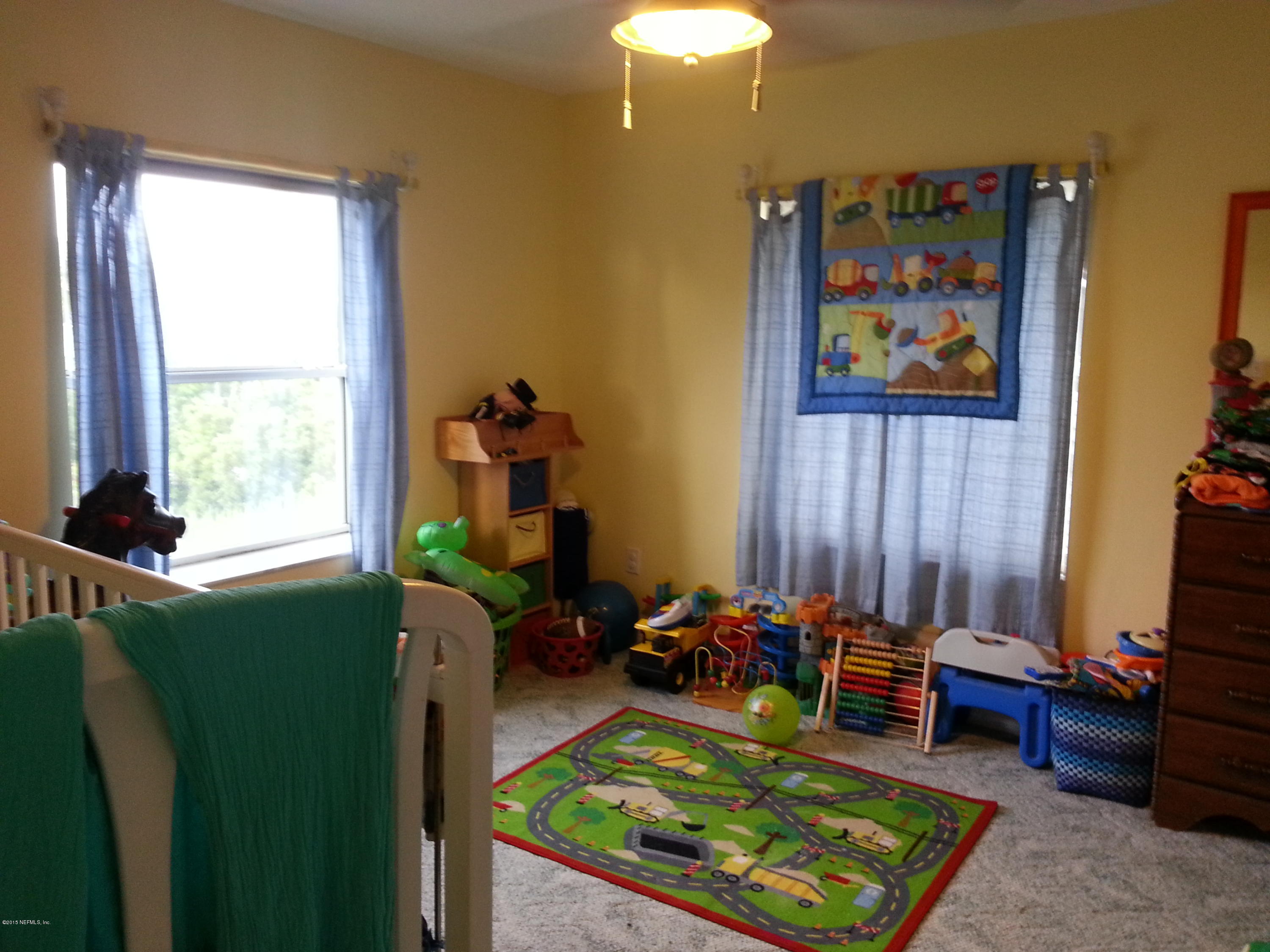 308 Outrigger Way Vilano Beach, FL 32084 - Photo 7 of 33 a room with furniture workspace and a window