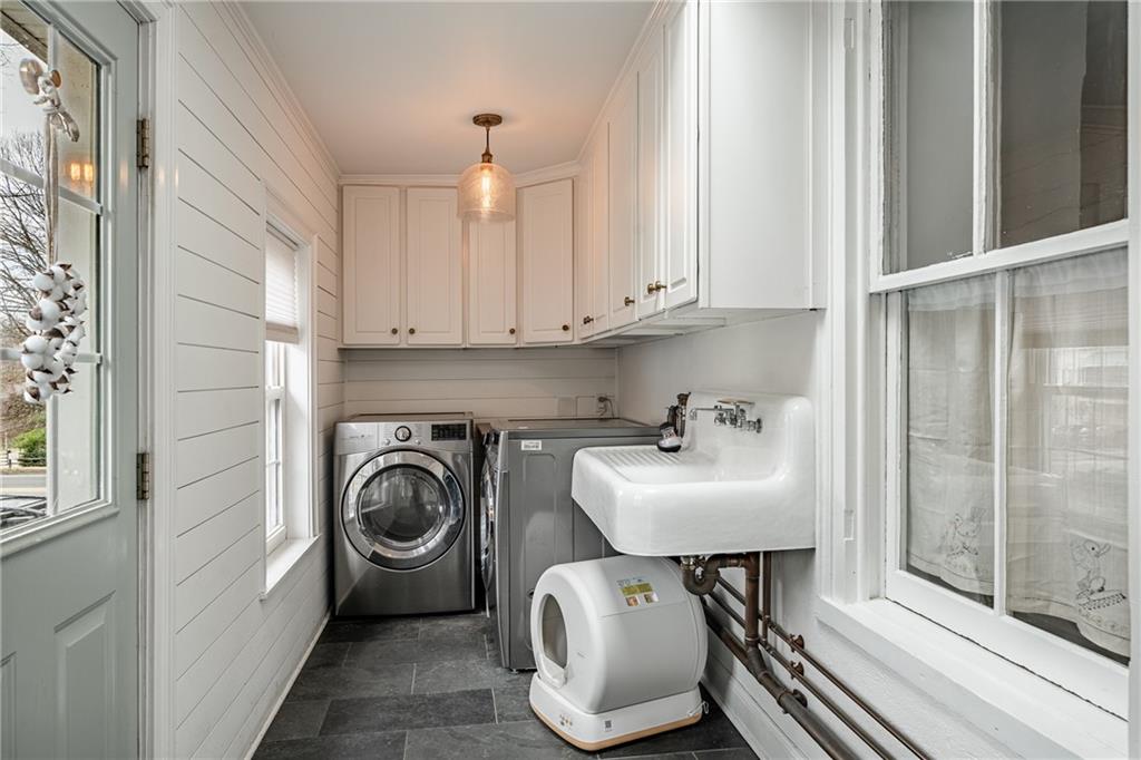 701 Oakbourne Road West Chester, PA 19382 - Photo 22 of 50 a utility room with sink dryer and washer