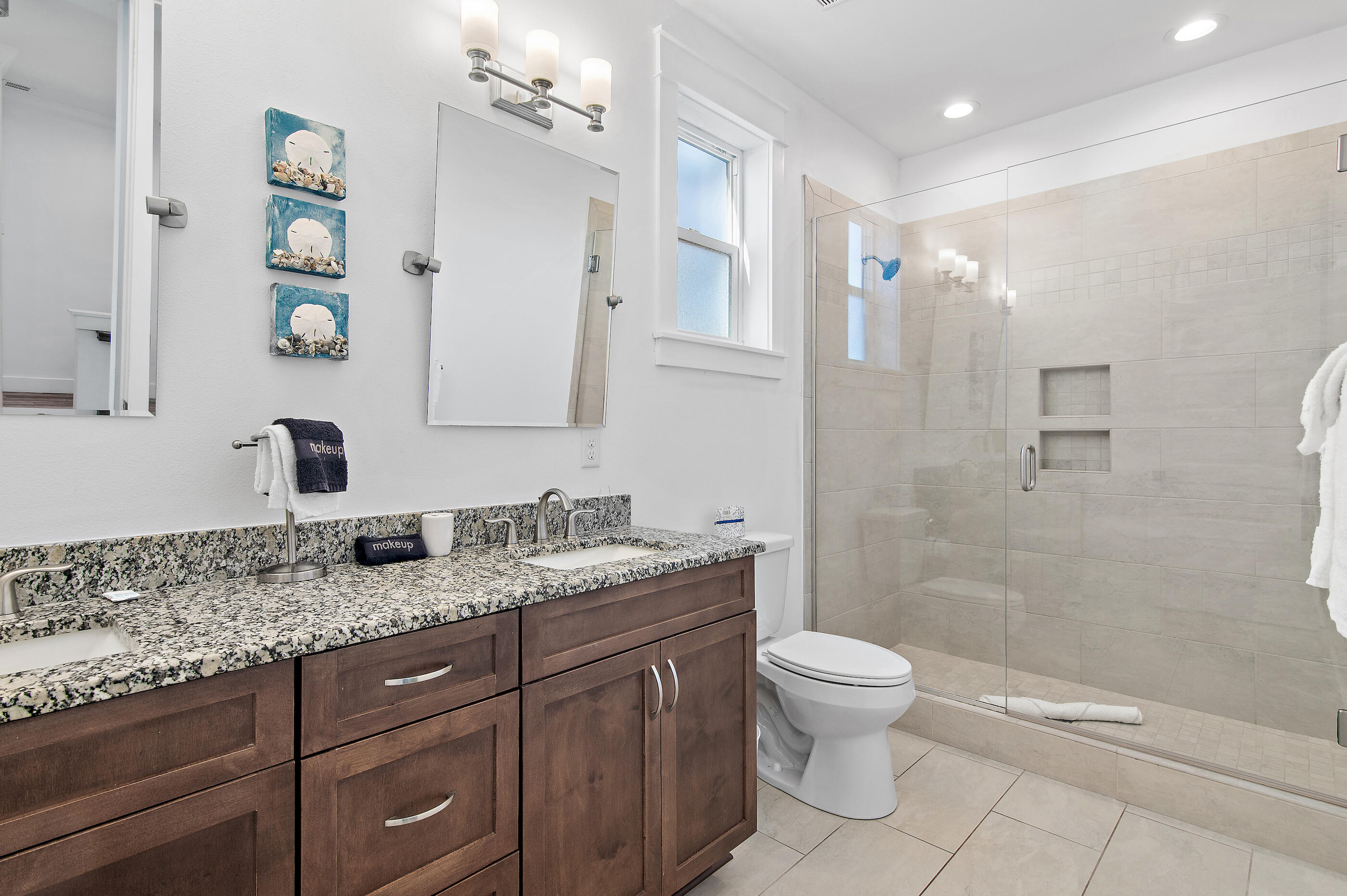 33 Sugar Sand Lane Santa Rosa Beach, FL 32459 - Photo 17 of 35 a bathroom with a granite countertop sink a toilet and a mirror