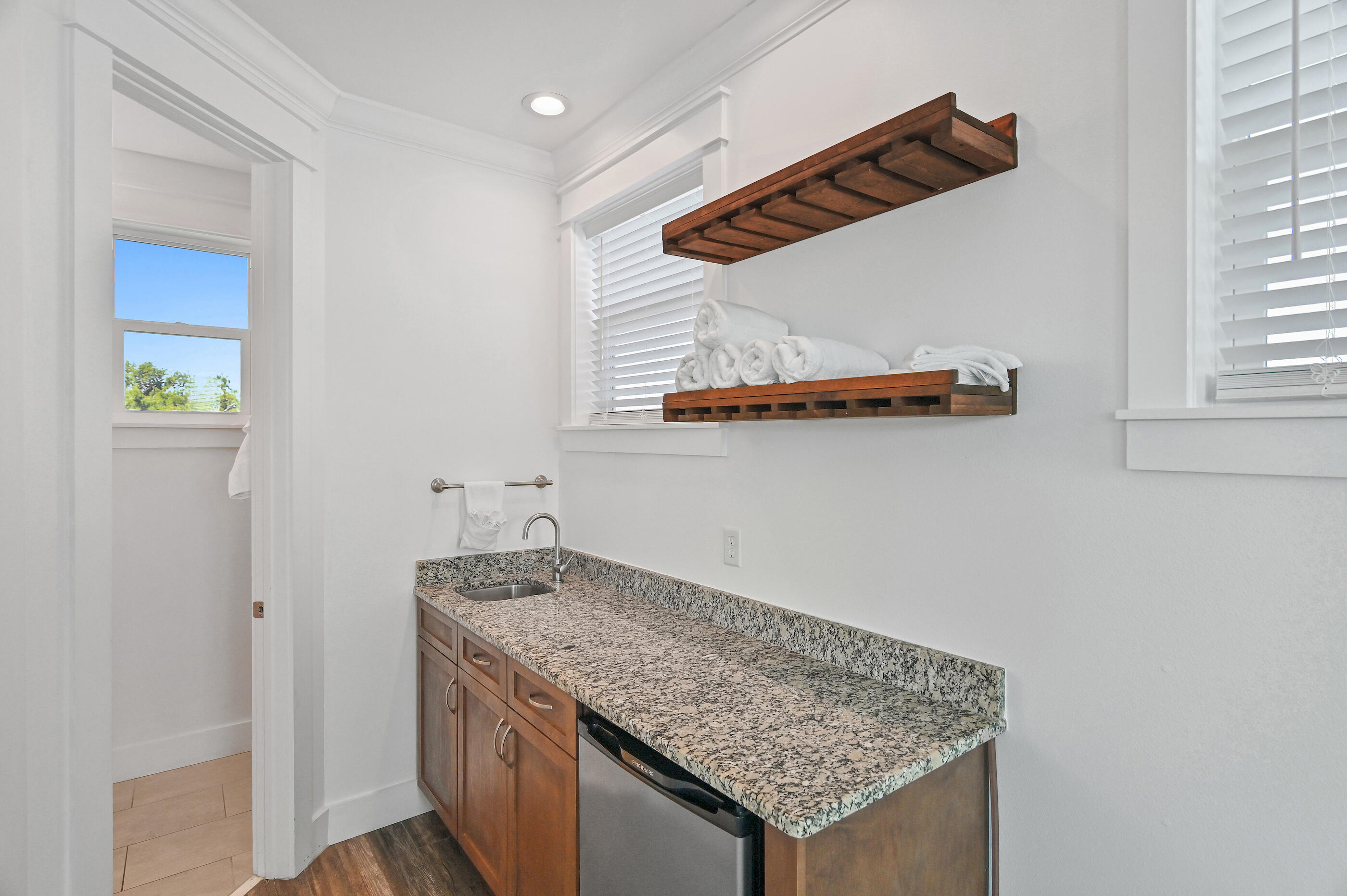 33 Sugar Sand Lane Santa Rosa Beach, FL 32459 - Photo 29 of 35 a kitchen with a sink a refrigerator and window