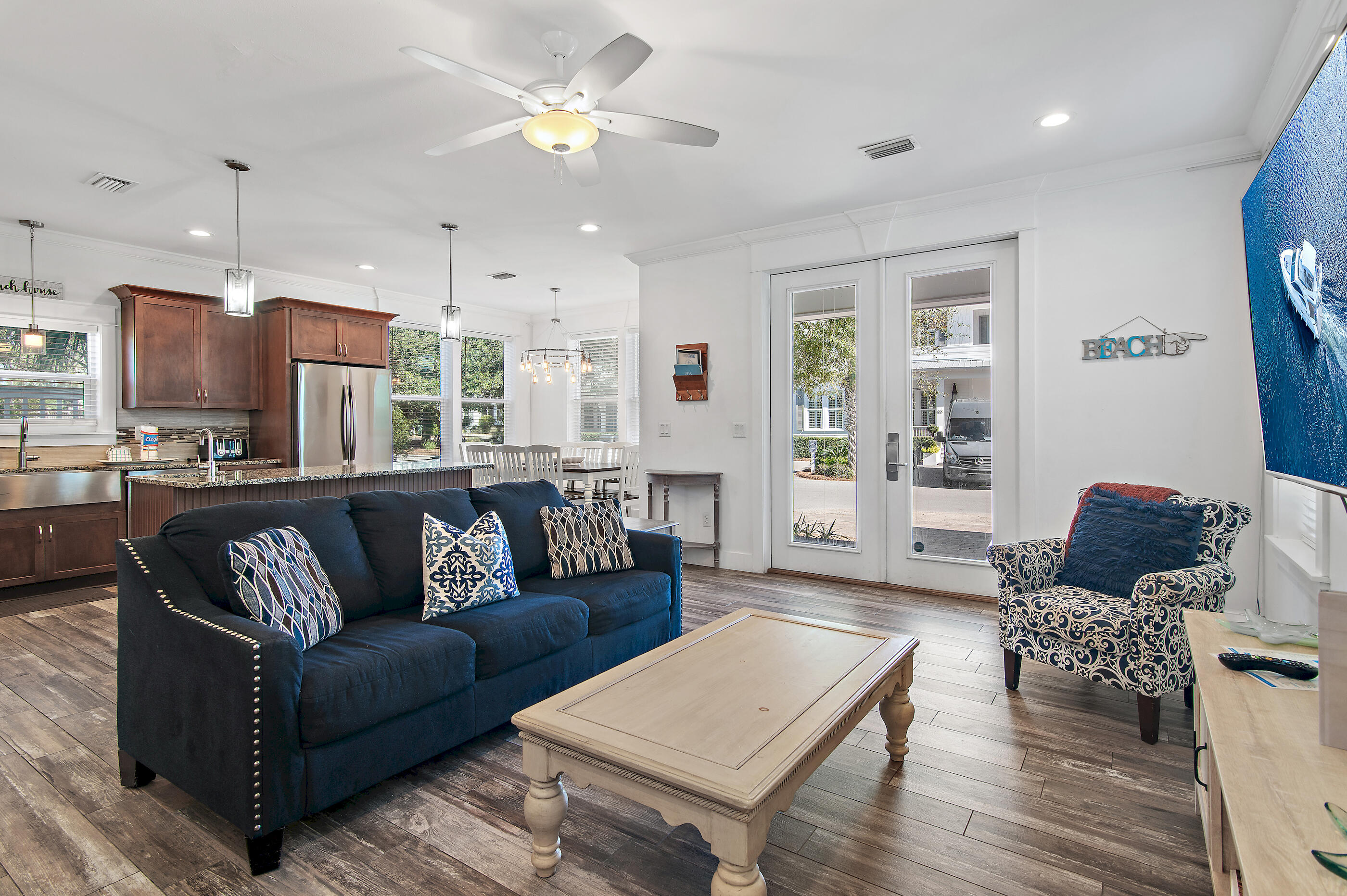 33 Sugar Sand Lane Santa Rosa Beach, FL 32459 - Photo 3 of 35 a view of living room kitchen with furniture and wooden floor