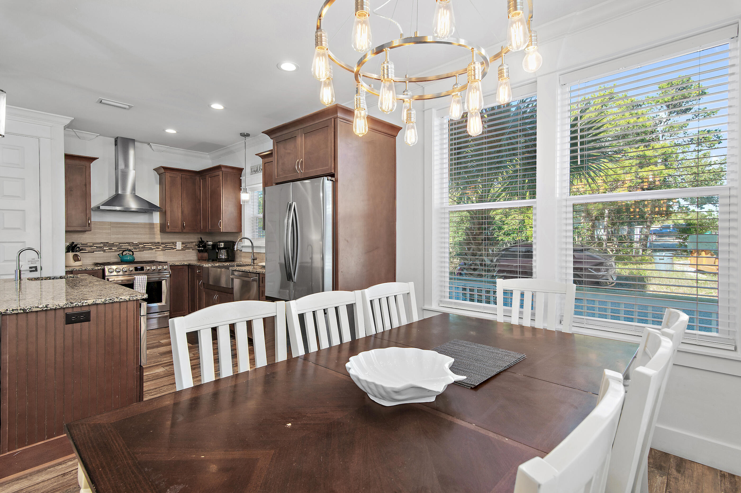 33 Sugar Sand Lane Santa Rosa Beach, FL 32459 - Photo 8 of 35 a kitchen with a table chairs refrigerator and chairs