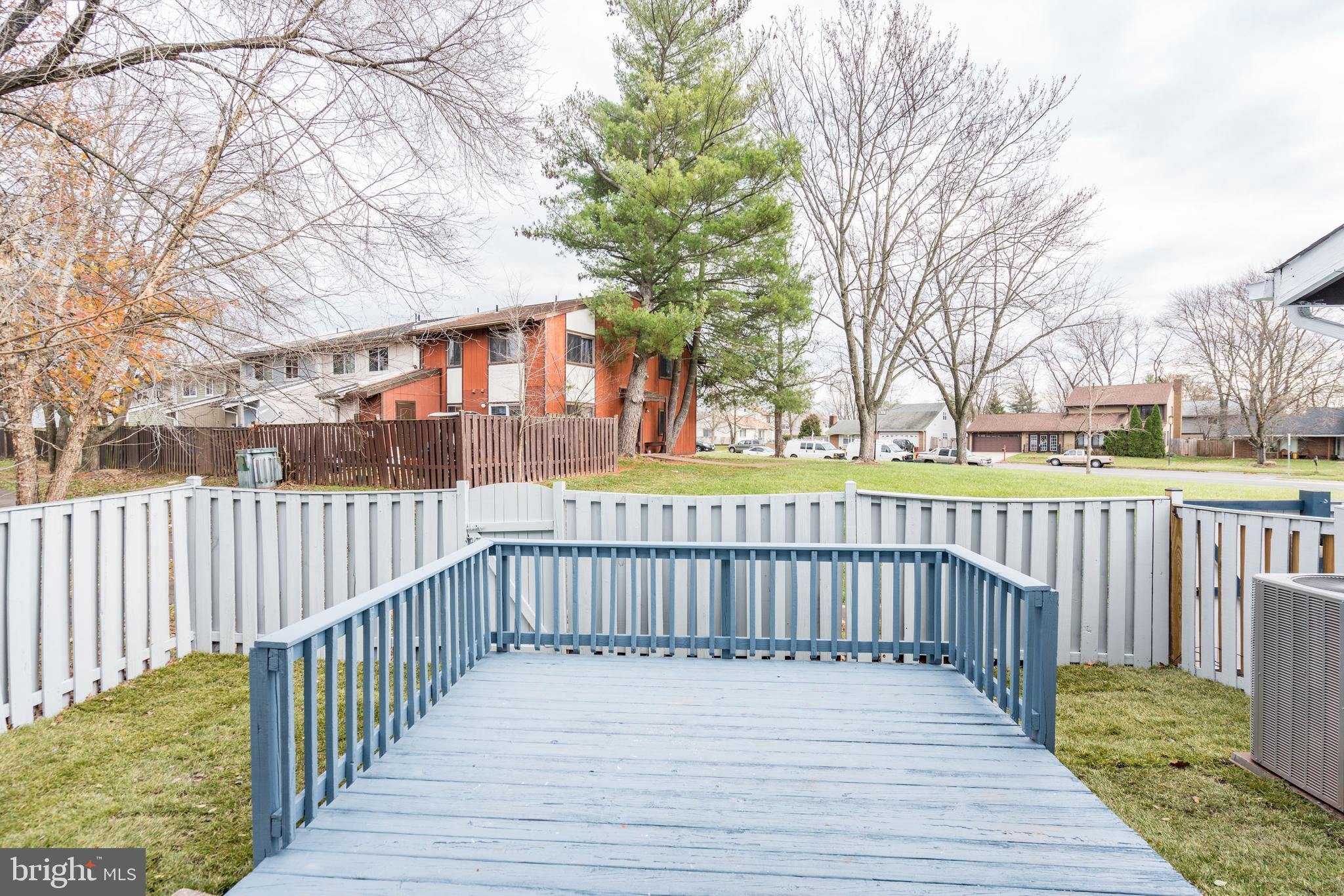122 North Cottage Road Sterling, VA 20164 - Photo 21 of 27 Fenced-in backyard with deck