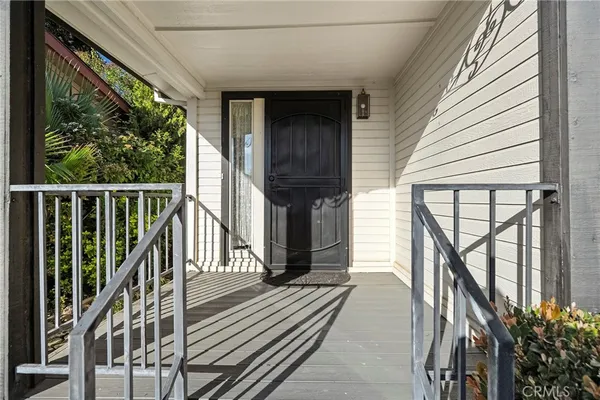 a view of a house with wooden floor and wooden stairs