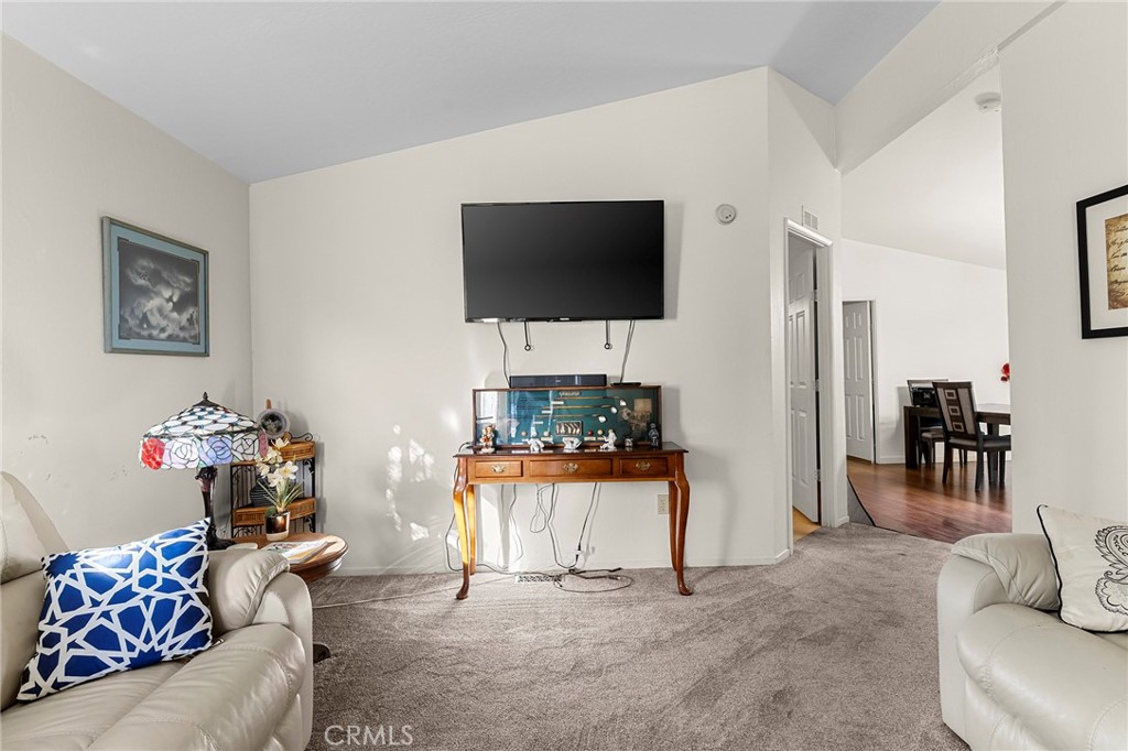 2050 Springfield Drive, Unit 323 Chico, CA 95928 - Photo 14 of 43 a living room with furniture and a flat screen tv