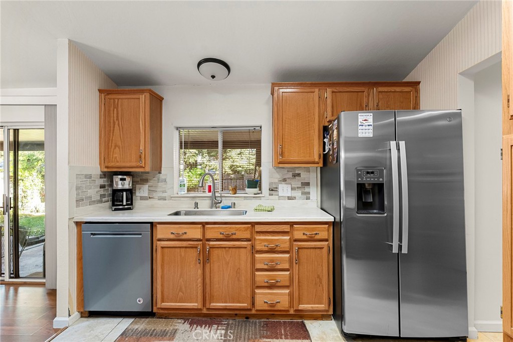 2050 Springfield Drive, Unit 323 Chico, CA 95928 - Photo 17 of 43 a kitchen with stainless steel appliances a refrigerator sink and cabinets